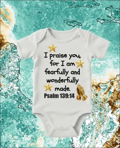 White baby bodysuit with Psalm 139:14 Bible verse "I praise you for I am fearfully and wonderfully made" printed alongside gold stars and praying hands.
