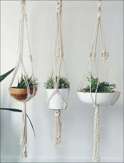 Macrame plant hanger with natural cotton rope showcasing three styles hanging with tassels.